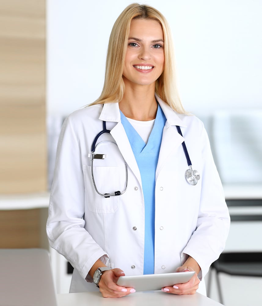 Portrait-of-a-female-doctor-holding-her-patient-chart-on-digital-tablet-in-bright-modern-hospital