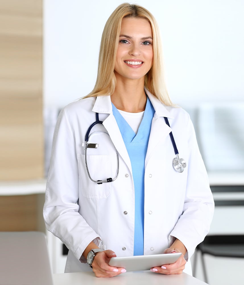 Portrait-of-a-female-doctor-holding-her-patient-chart-on-digital-tablet-in-bright-modern-hospital Portrait-of-a-female-doctor-holding-her-patient-chart-on-digital-tablet-in-bright-modern-hospital